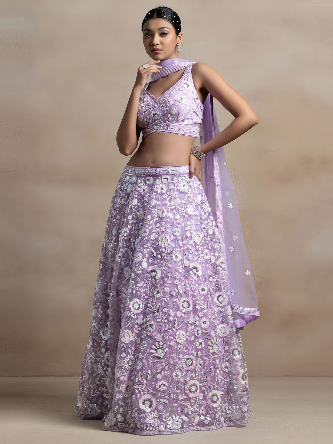 Surprising Lavender Sequins Net Reception Wear Lehenga Choli