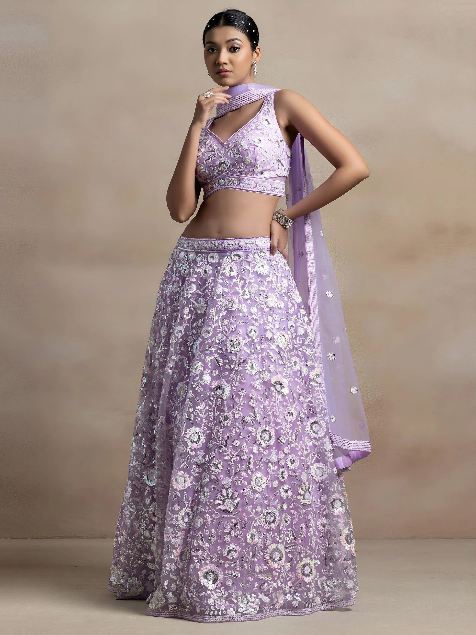 Surprising Lavender Sequins Net Reception Wear Lehenga Choli