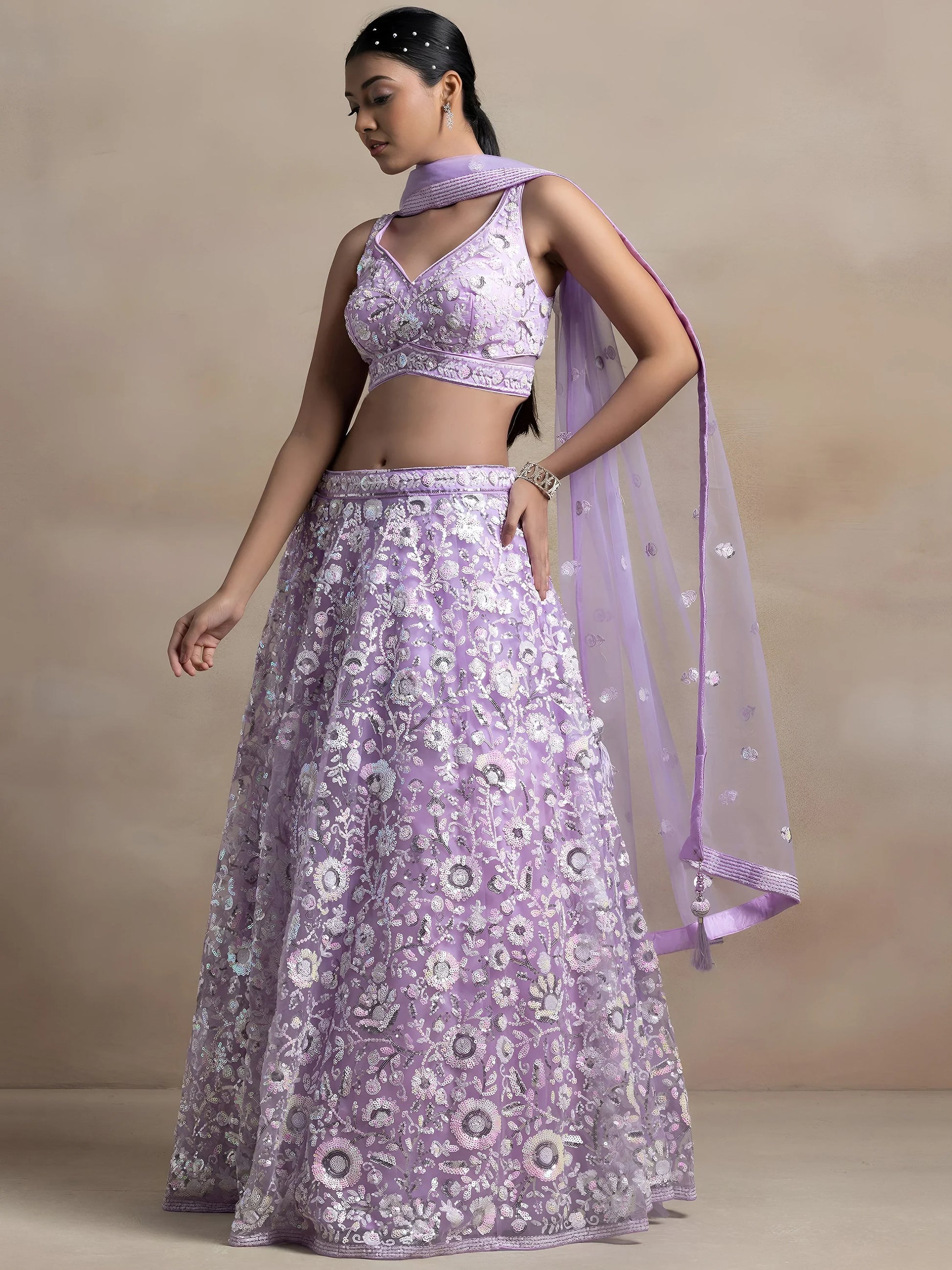 Surprising Lavender Sequins Net Reception Wear Lehenga Choli