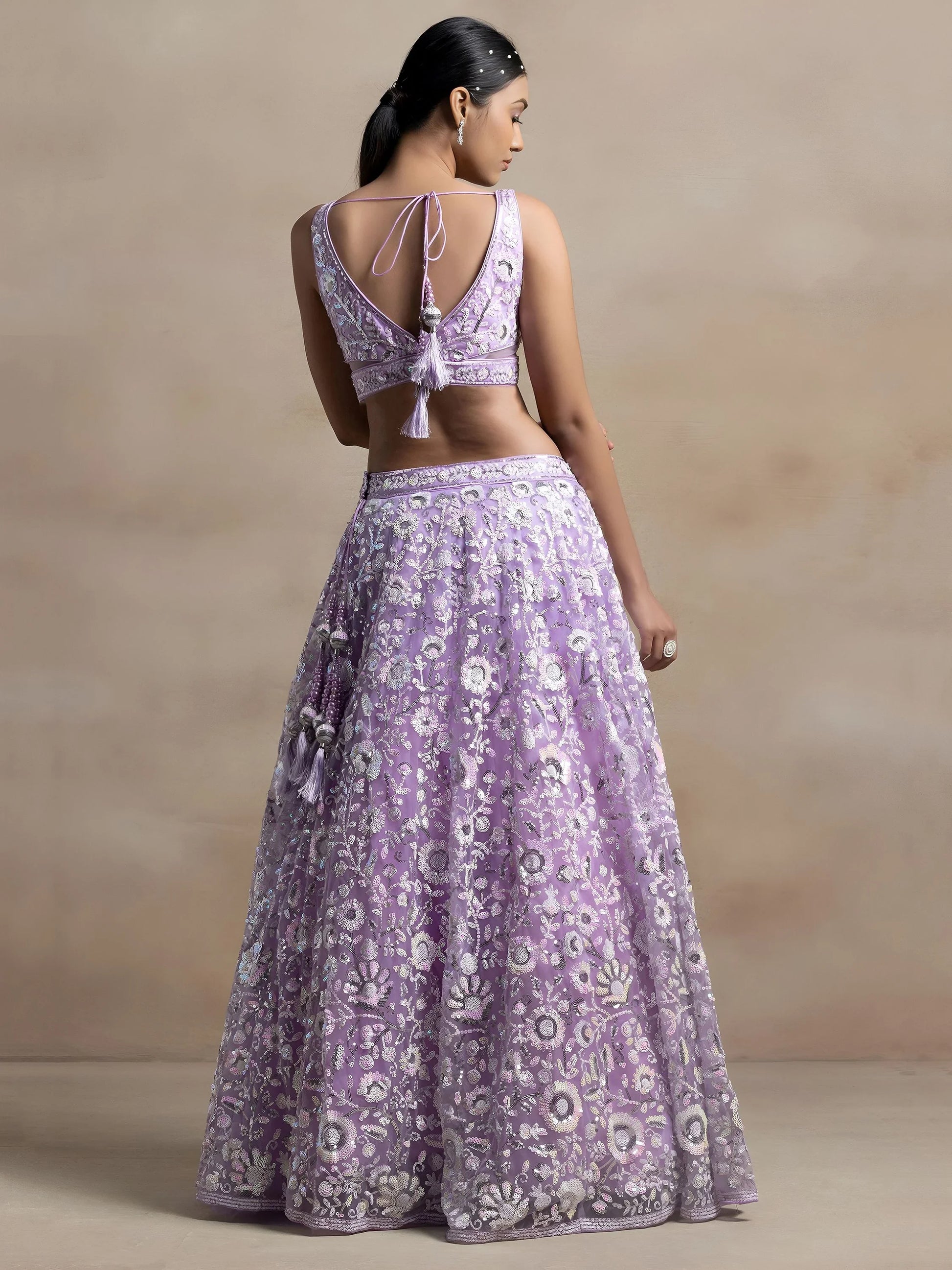 Surprising Lavender Sequins Net Reception Wear Lehenga Choli