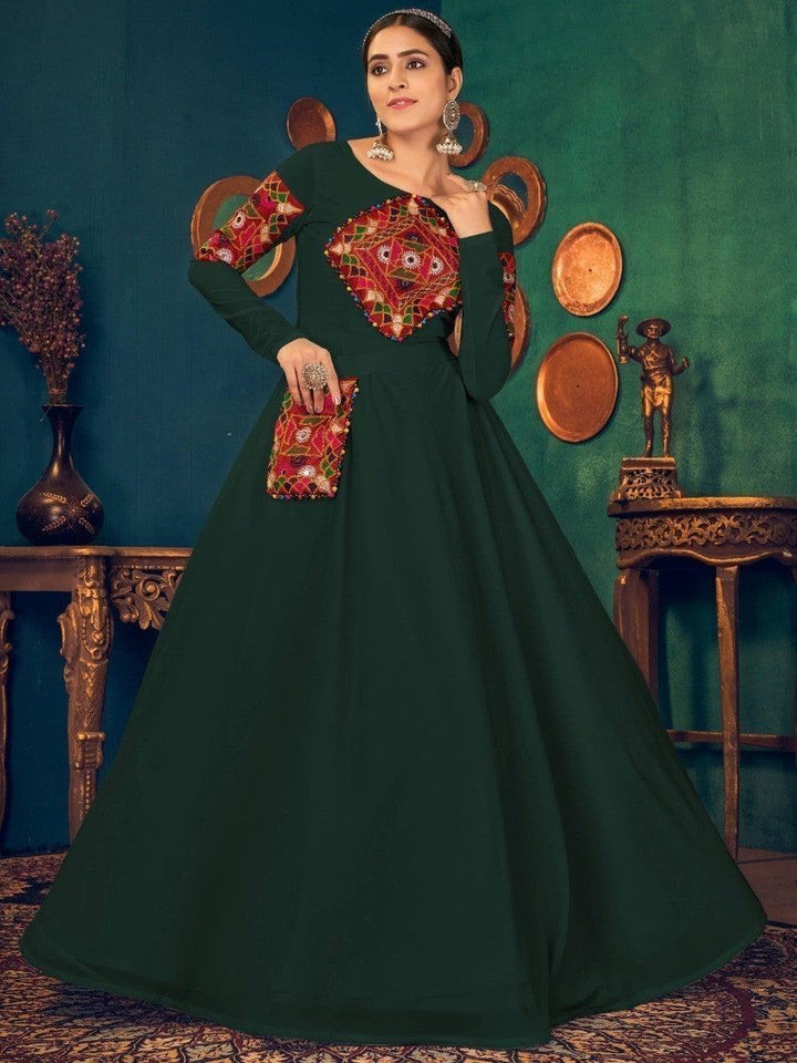 Elegant green anarkali with colorful mirror work, perfect for festive occasions and traditional events.