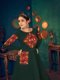 Green embroidered anarkali dress with colorful mirror work, perfect for festive occasions and traditional events.