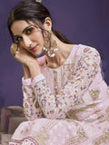 Elegant pink embroidered women's outfit with floral patterns and gold detailing, perfect for festive occasions.