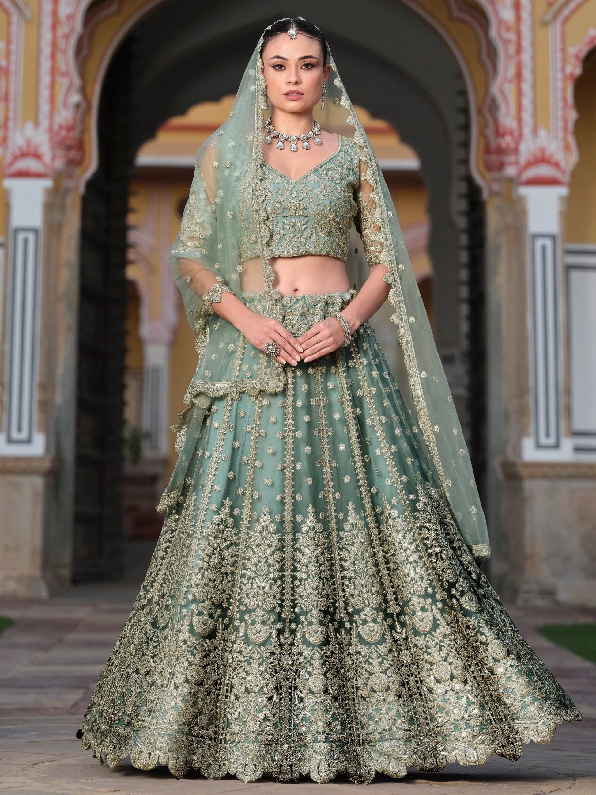 Wonderful Pista Green Embroidered Net Engagement Wear Lehenga Choli
