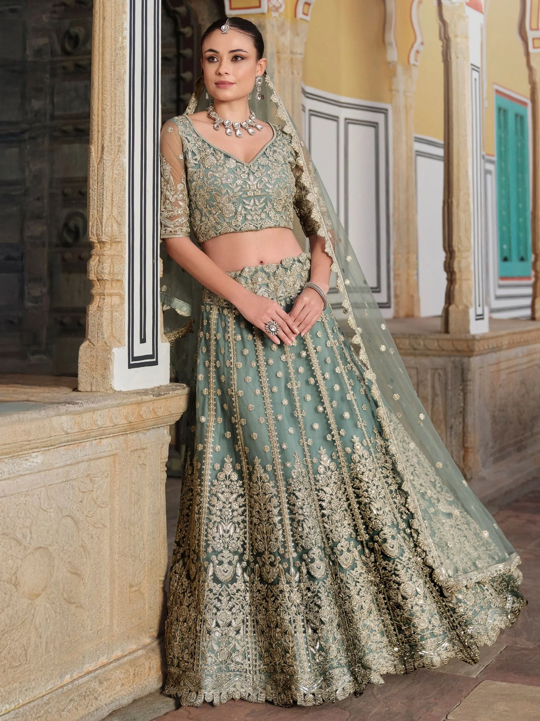 Wonderful Pista Green Embroidered Net Engagement Wear Lehenga Choli