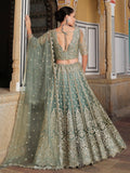 Wonderful Pista Green Embroidered Net Engagement Wear Lehenga Choli