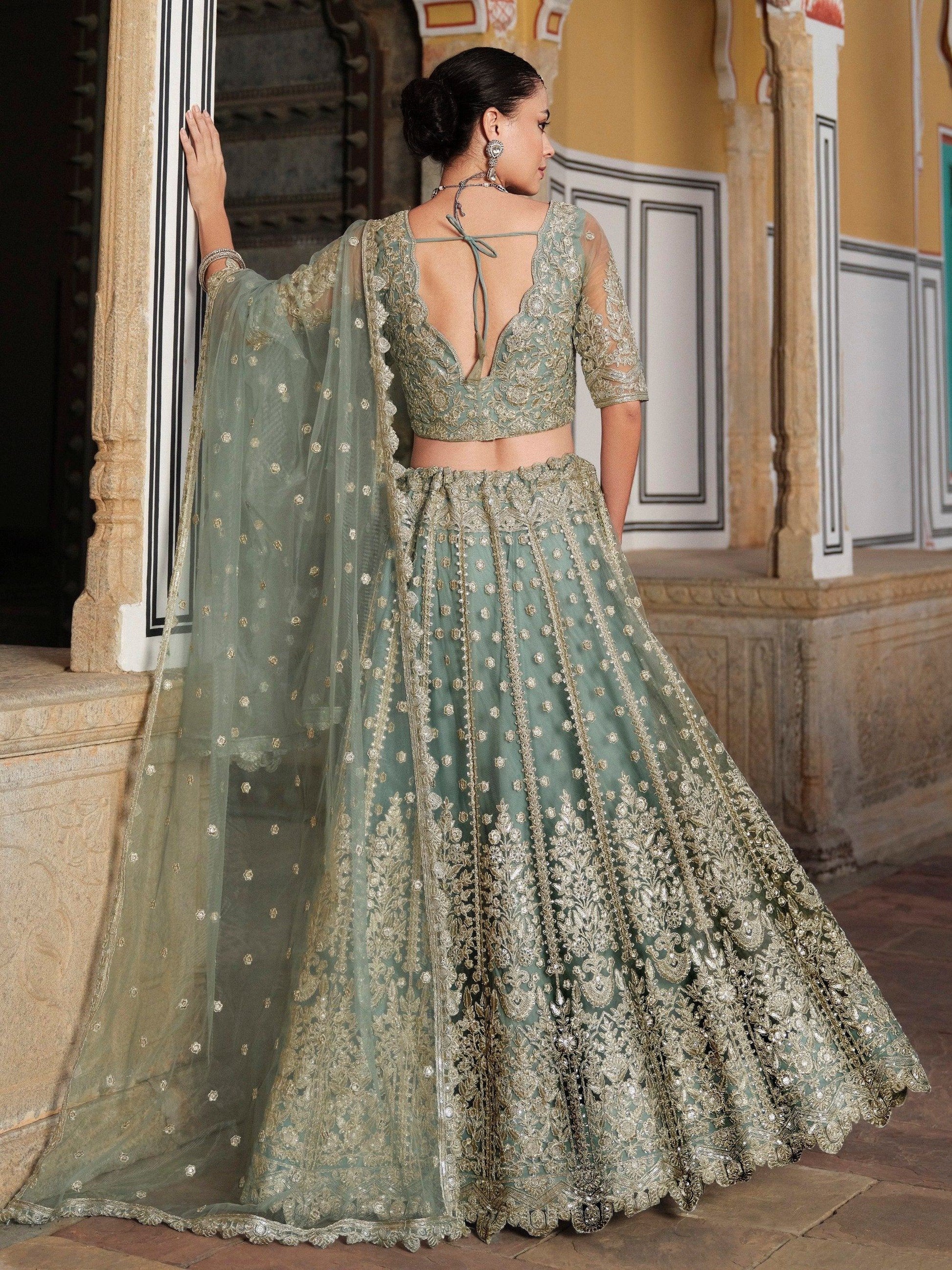 Wonderful Pista Green Embroidered Net Engagement Wear Lehenga Choli