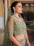 Wonderful Pista Green Embroidered Net Engagement Wear Lehenga Choli