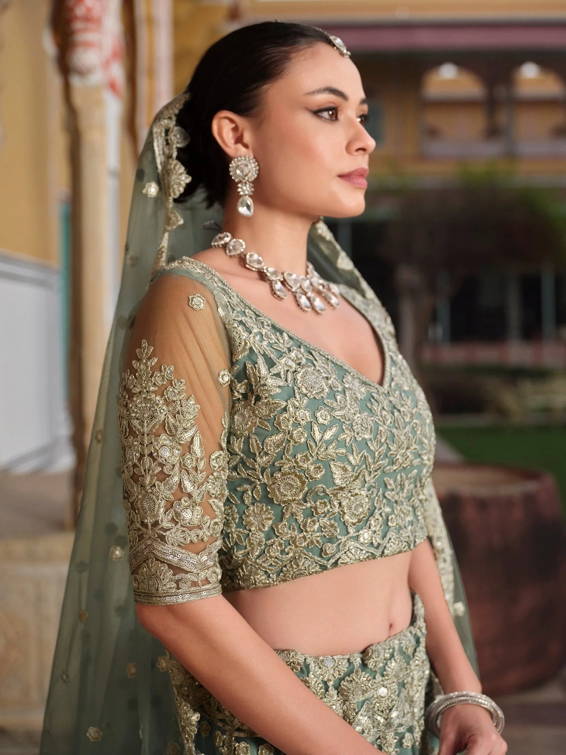 Wonderful Pista Green Embroidered Net Engagement Wear Lehenga Choli