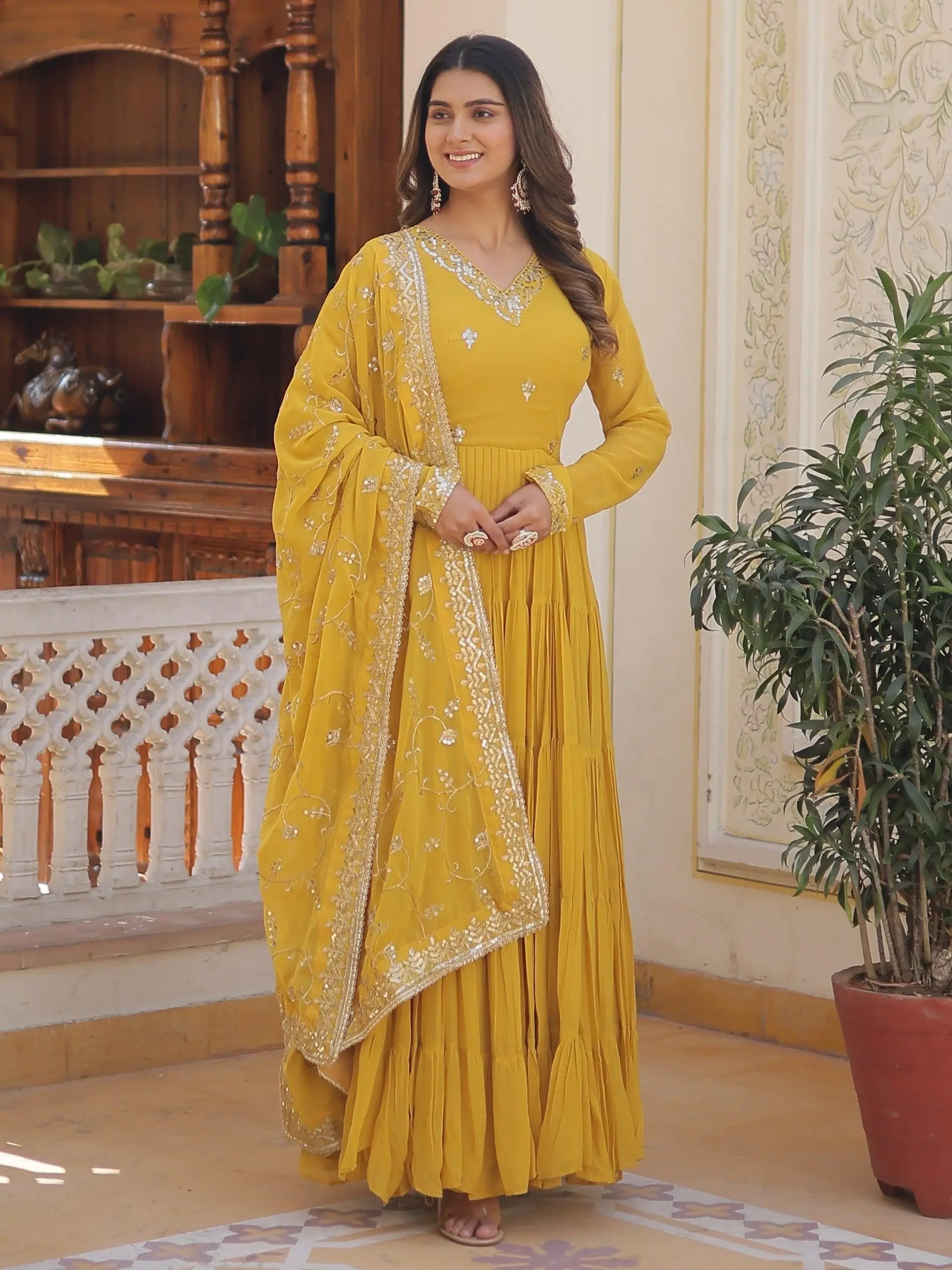Wonderful Yellow Ruffle Work Georgette Haldi Wear Gown With Dupatta - Zeel Clothing