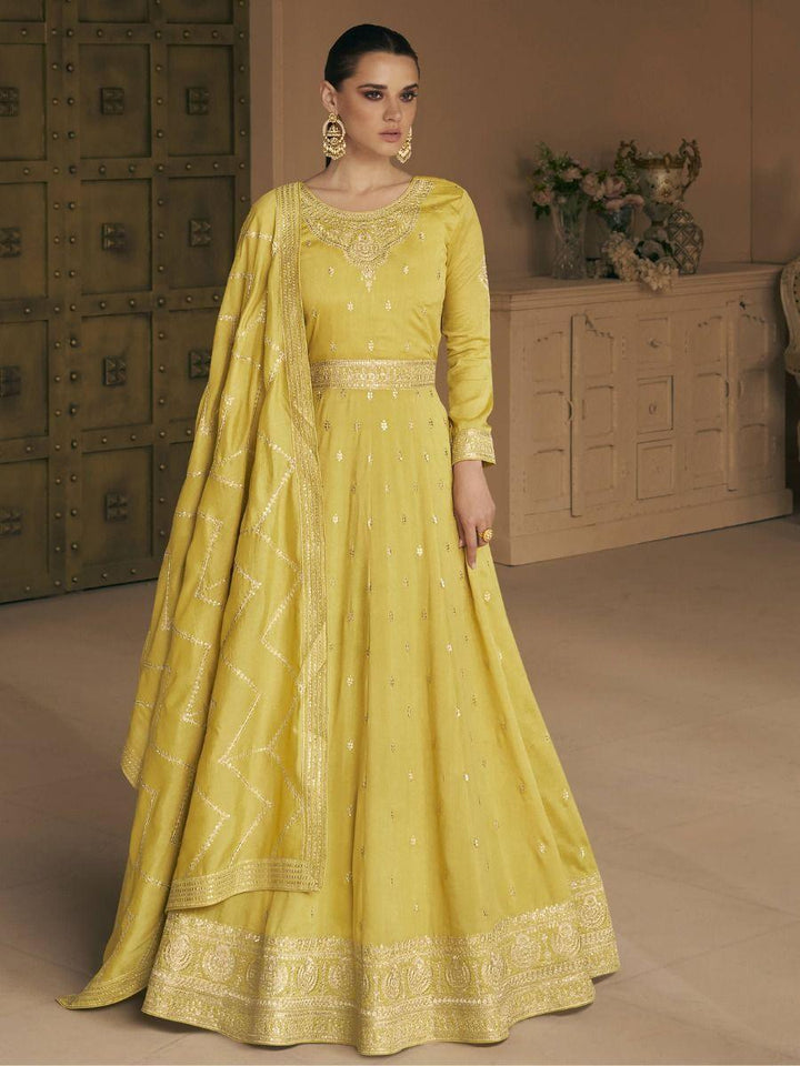 Enchanting Yellow Embroidered Silk Wedding Wear Gown With Dupatta