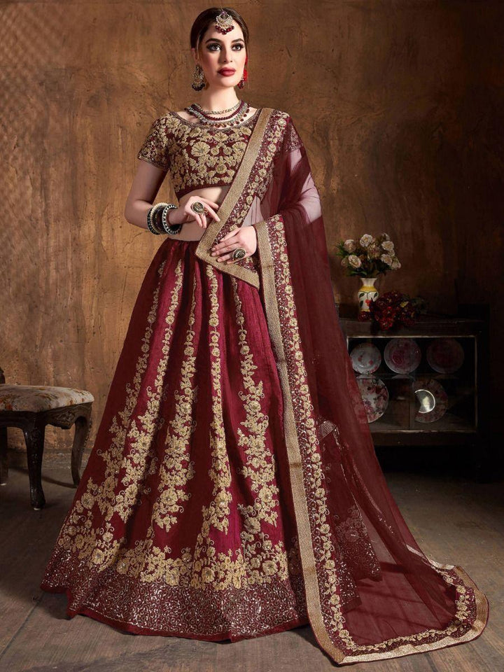 Mesmerizing Maroon Embroidered Raw Silk Lehenga Choli With Dupatta