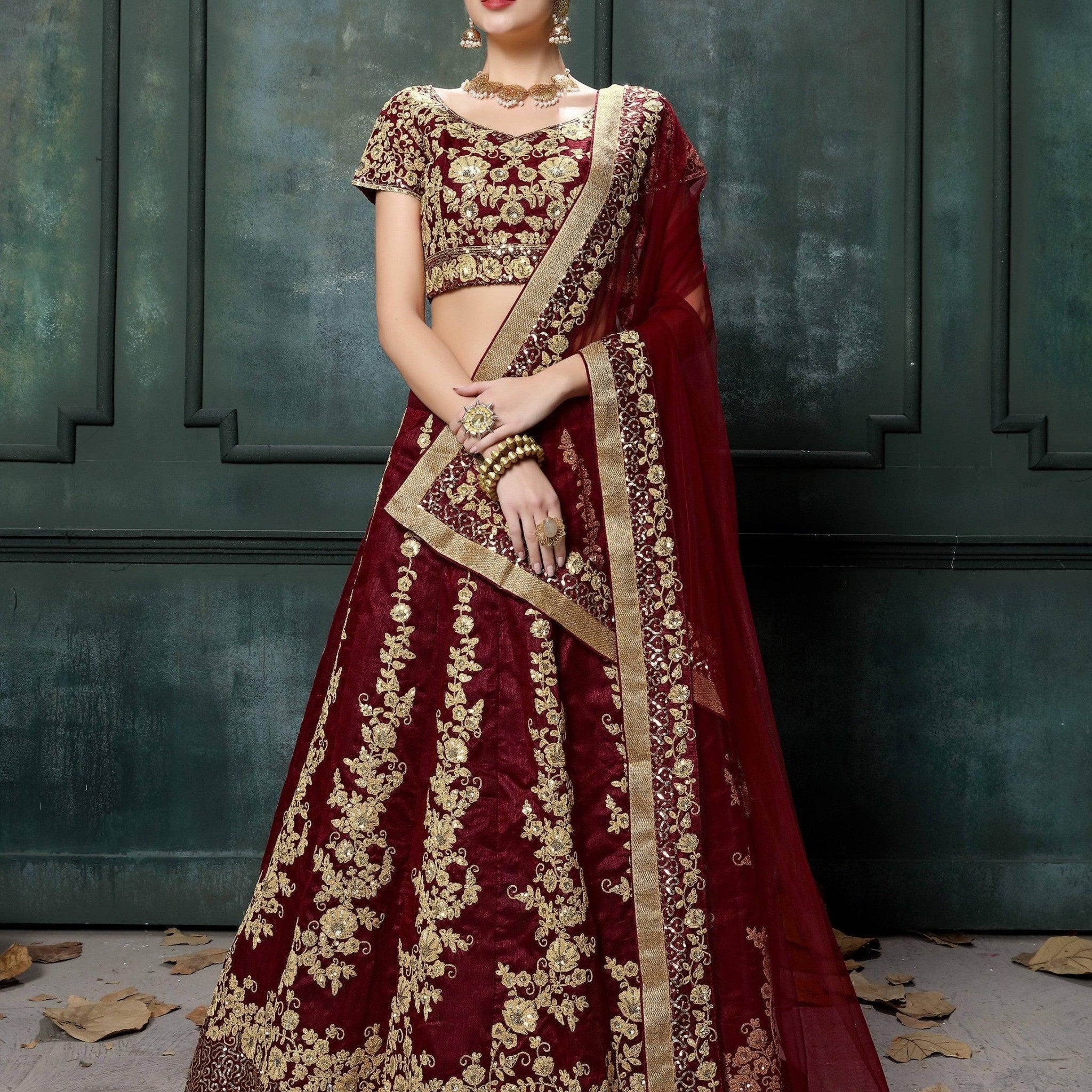 Impressive Maroon Colored Designer Partywear Raw Silk Lehenga Choli