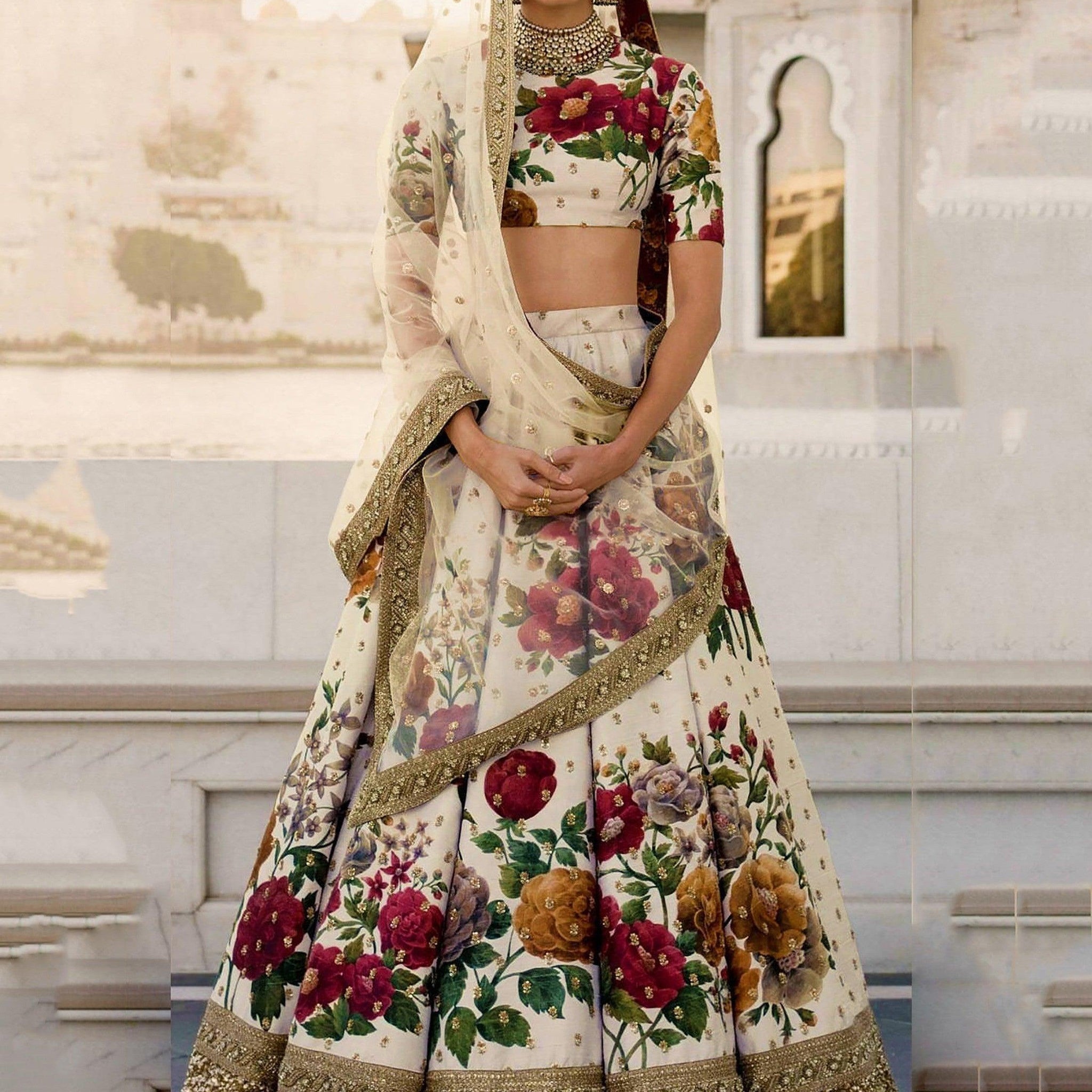 Gorgeous Cream Colored Partywear Designer Embroidered Lehenga Choli