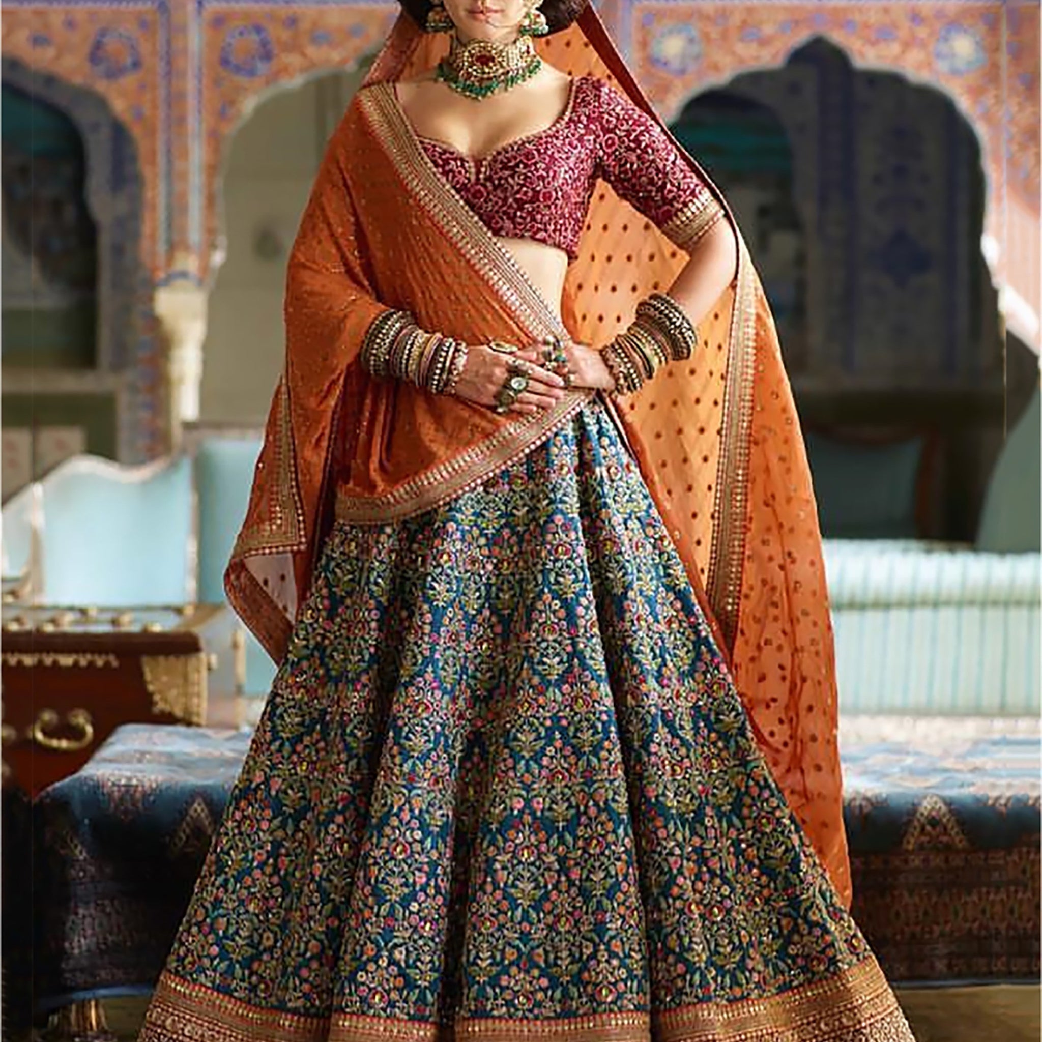 Flamboyant Blue-Red Colored Bridal wear Embroidered Lehenga Choli