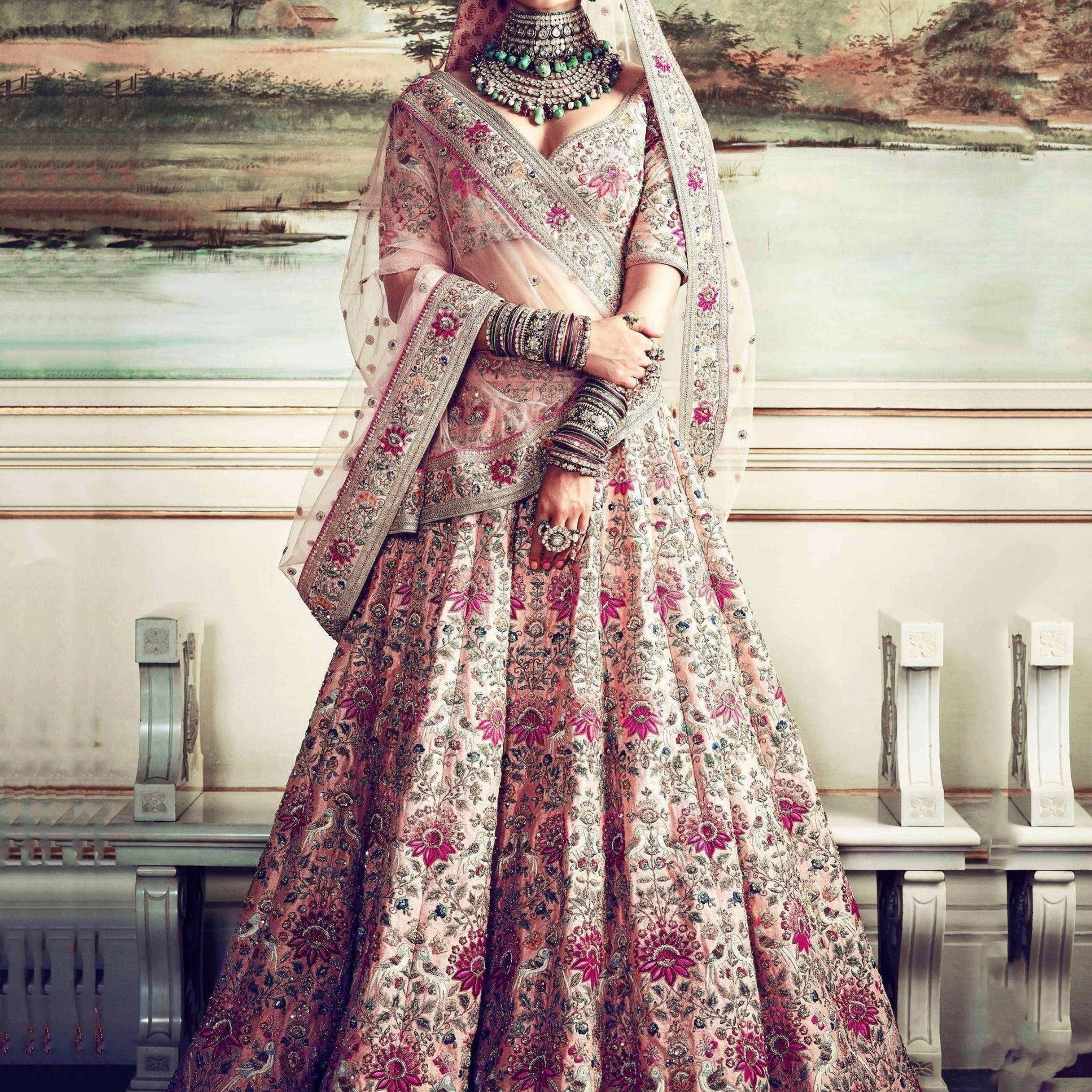 Prominent peach Colored Bridal wear Embroidered Lehenga Choli