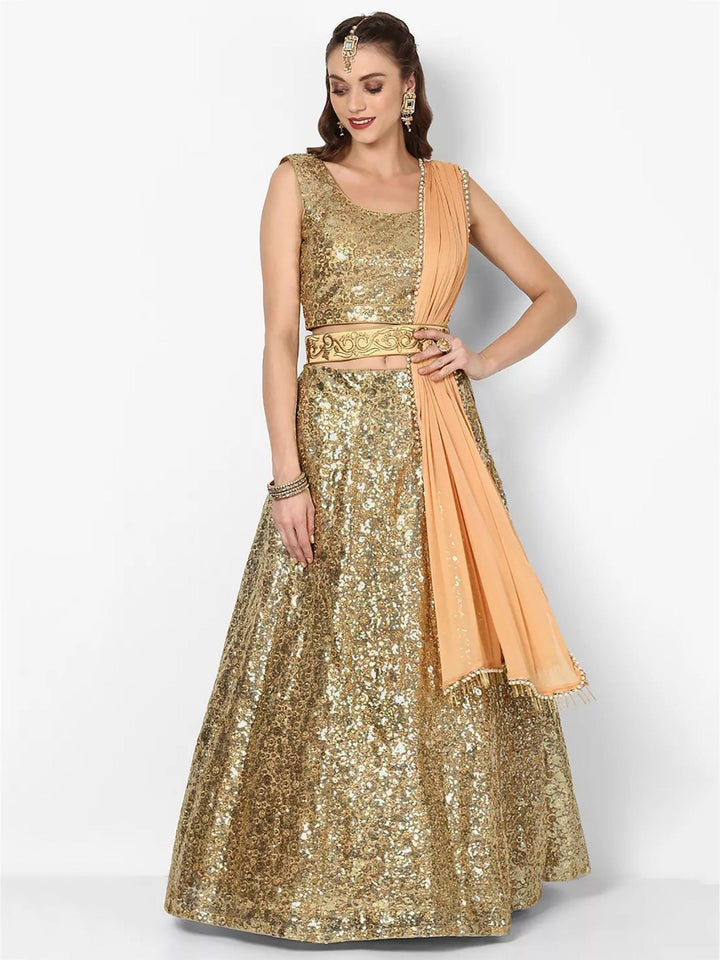 Stunning Golden Colored Party wear Embroidered Netted Lehenga Choli