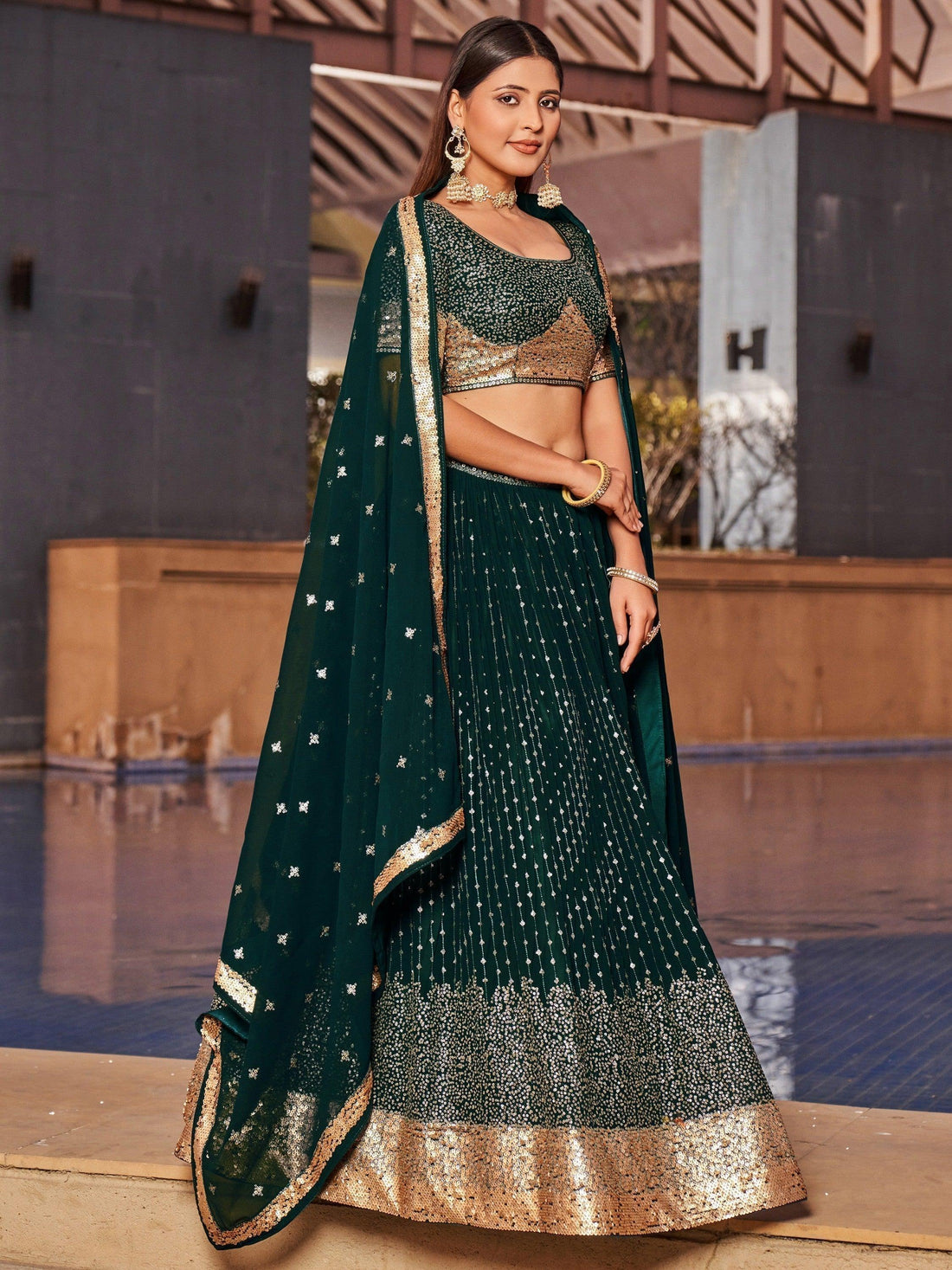 Enchanting Green Sequins Georgette Mehendi Wear Lehenga Choli