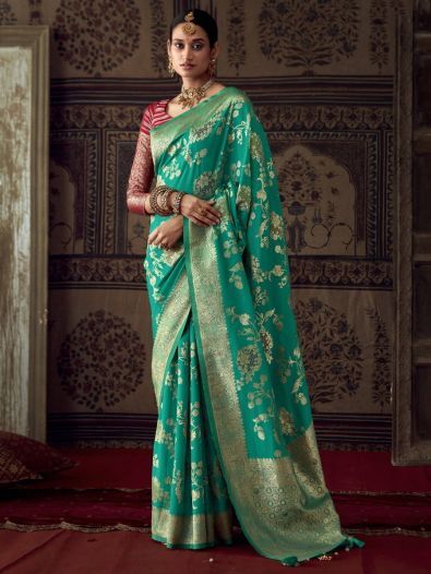 Bewitching Teal Green Zari Weaving Georgette Saree With Blouse