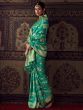 Bewitching Teal Green Zari Weaving Georgette Saree With Blouse