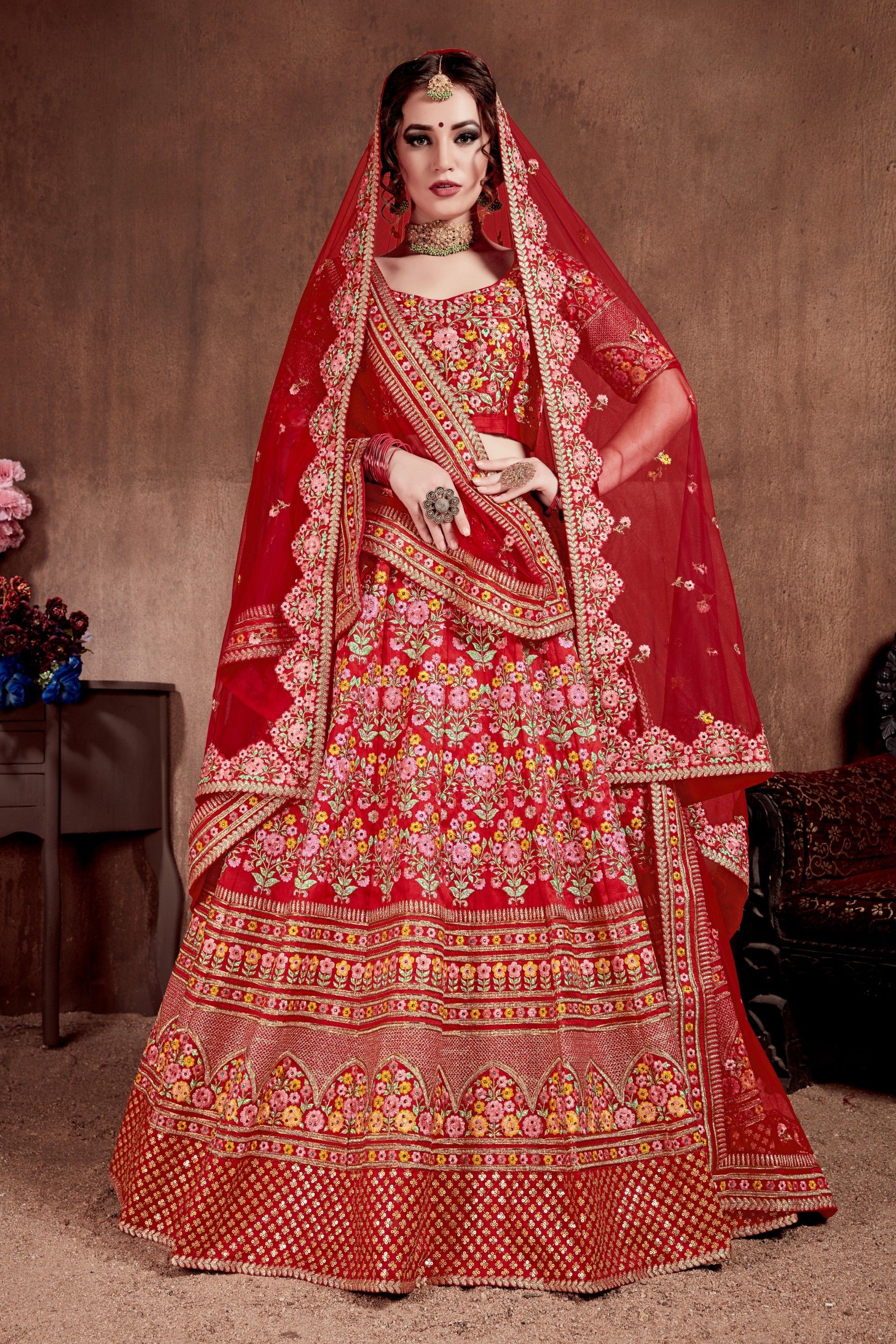 Flattering Red Colored Designer Bridal wear Embroidered Lehenga Choli